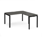 L-shaped desk with grey top and black metal frame on a white background