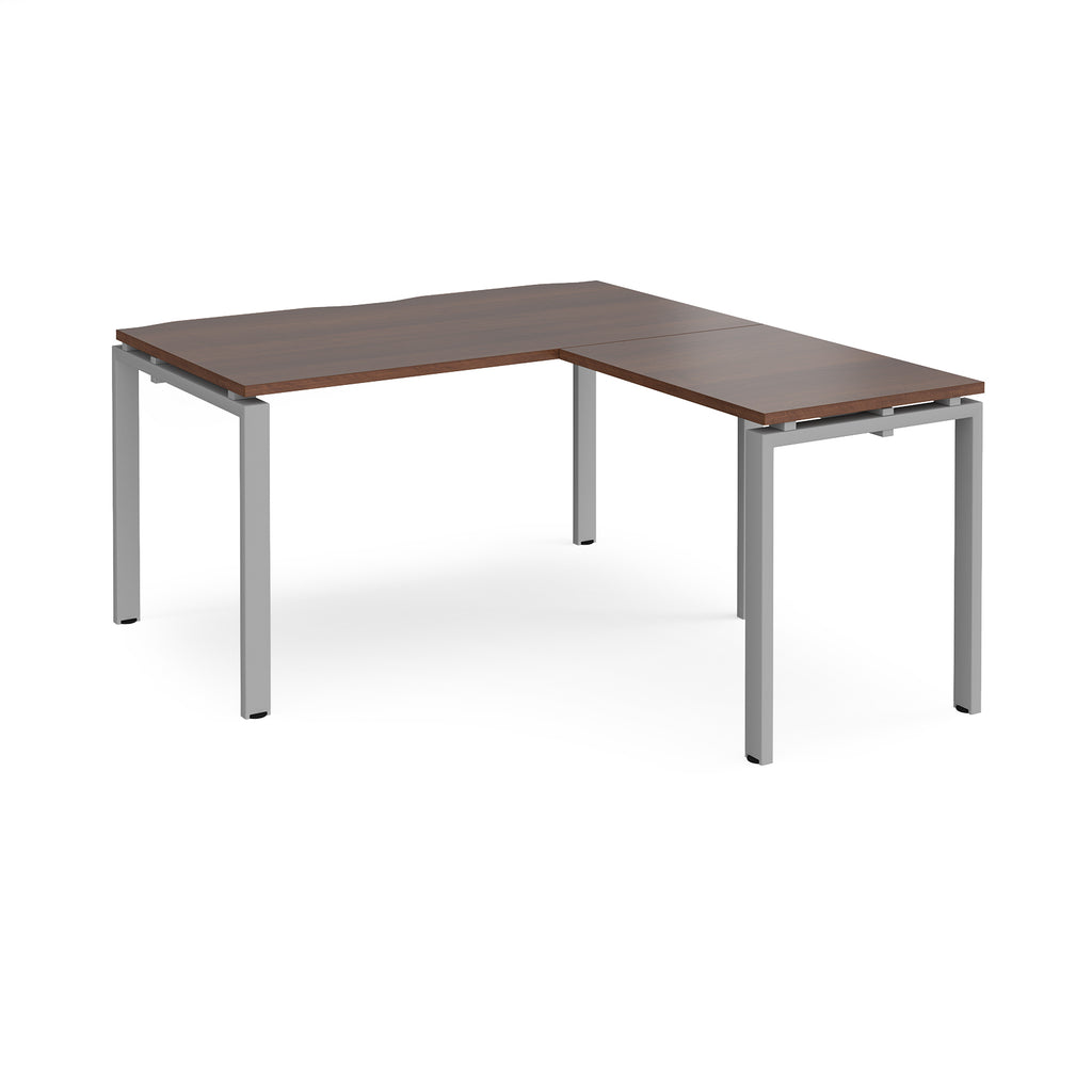 L-shaped desk with wood-effect top and silver metal frame on a white background