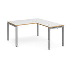 L-shaped desk with white top with wooden edges and silver metal frame on a white background