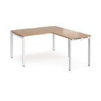 L-shaped desk with wood-effect top and white metal frame on a white background