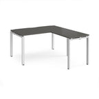 L-shaped desk with grey top and white metal frame on a white background