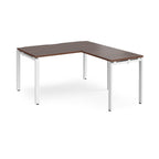 L-shaped desk with wood-effect top and white metal frame on a white background