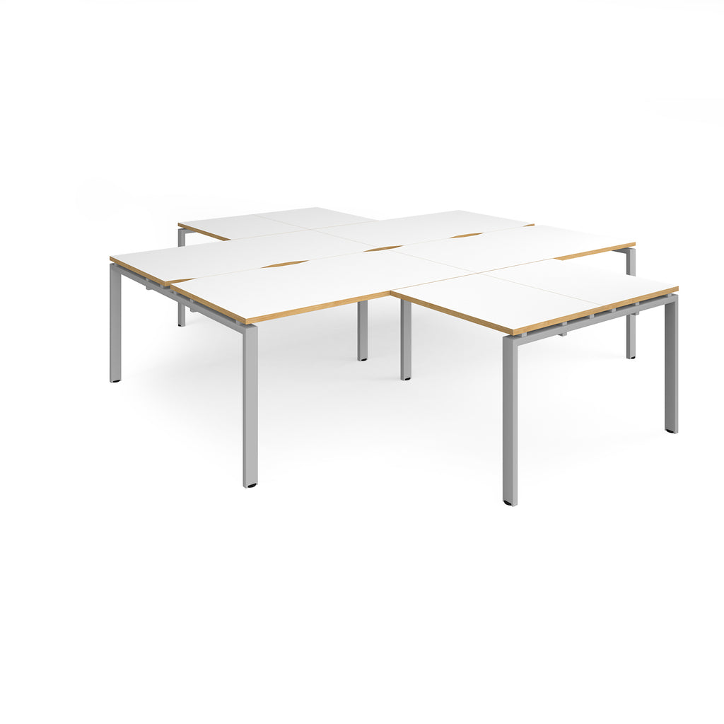 L-shaped office desks cluster with white top with wooden edges and silver metal legs on a white background