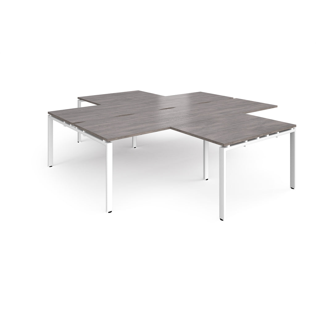 L-shaped office desks cluster with grey wood-effect top and white metal legs on a white background