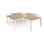 L-shaped office desks cluster with wood-effect top and white metal legs on a white background