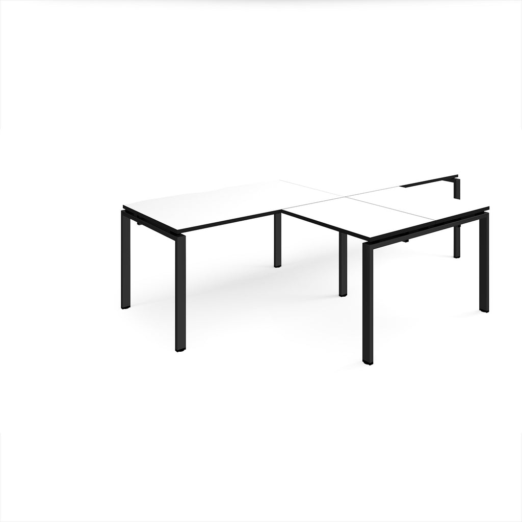 L-shaped back-to-back desks with white top with black edges and black metal legs on a white background