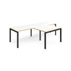 L-shaped back-to-back desks with white top with wooden edges and black metal legs on a white background