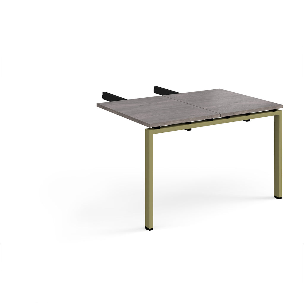 Desk add-on unit with grey wood-effect top and green metal frame on a white background