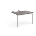 Desk add-on unit with grey wood-effect top and white metal frame on a white background