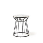 Side table with marble effect top and black metal frame on a white background