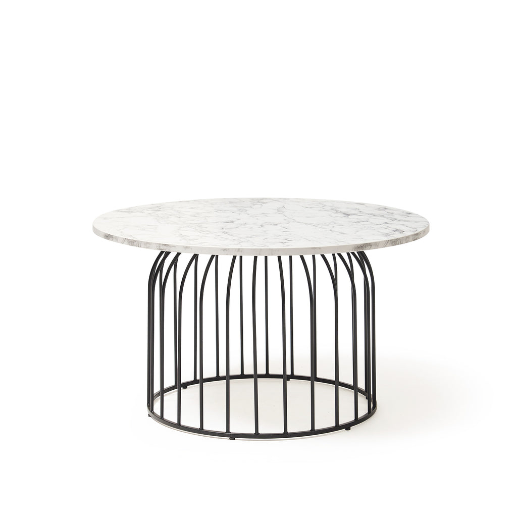 Round coffee table with marble effect top and black metal base on a white background