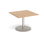 Square table with wood-effect top and brushed steel pedestal base on a white background
