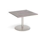 Square table with grey wood-effect top and brushed steel pedestal base on a white background