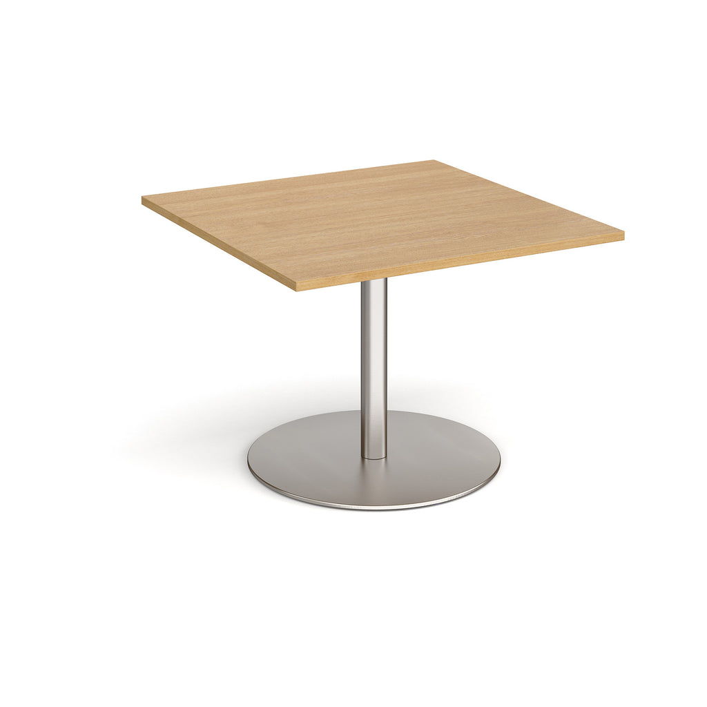 Square table with wood-effect top and brushed steel pedestal base on a white background