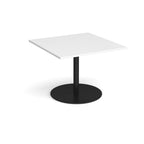 Square table with white top and black pedestal base on a white background