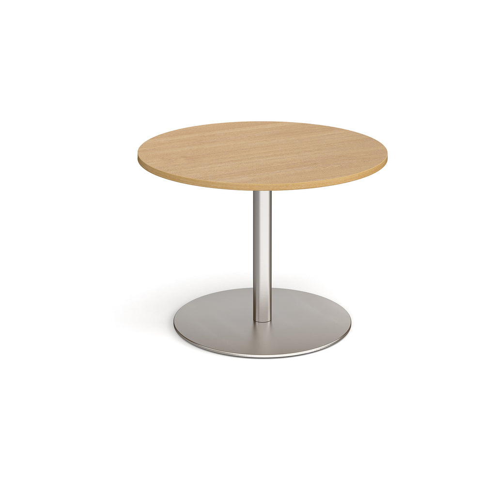 Round wooden table with metal base on a white background