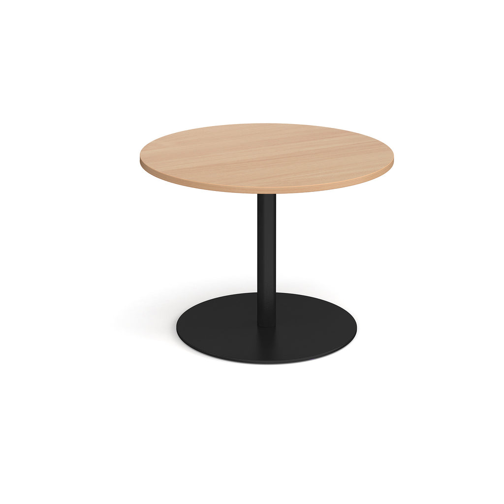 Round wooden table with a black base on a white background