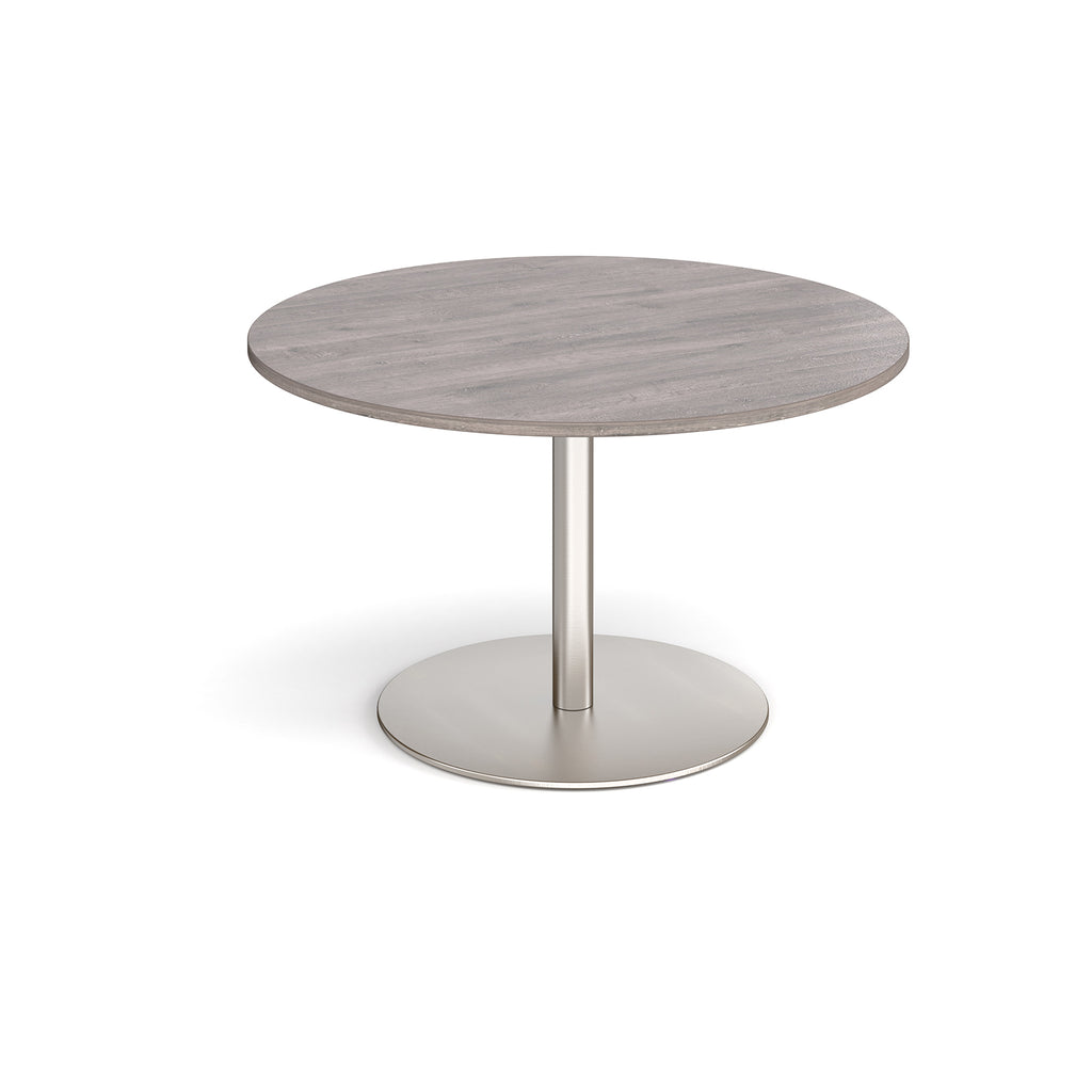 Round table with a wooden top and metal base on a white background