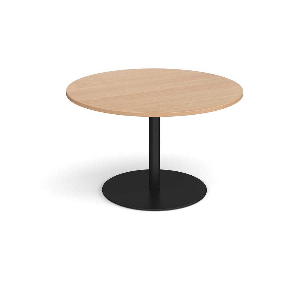 Round wooden table with a black base on a white background