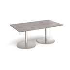 A rectangular meeting table with a grey wood-effect top and two round brushed steel pedestal bases, shown on a clean white background.