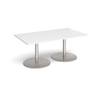A rectangular meeting table with a white top and two round brushed steel pedestal bases, shown on a clean white background.