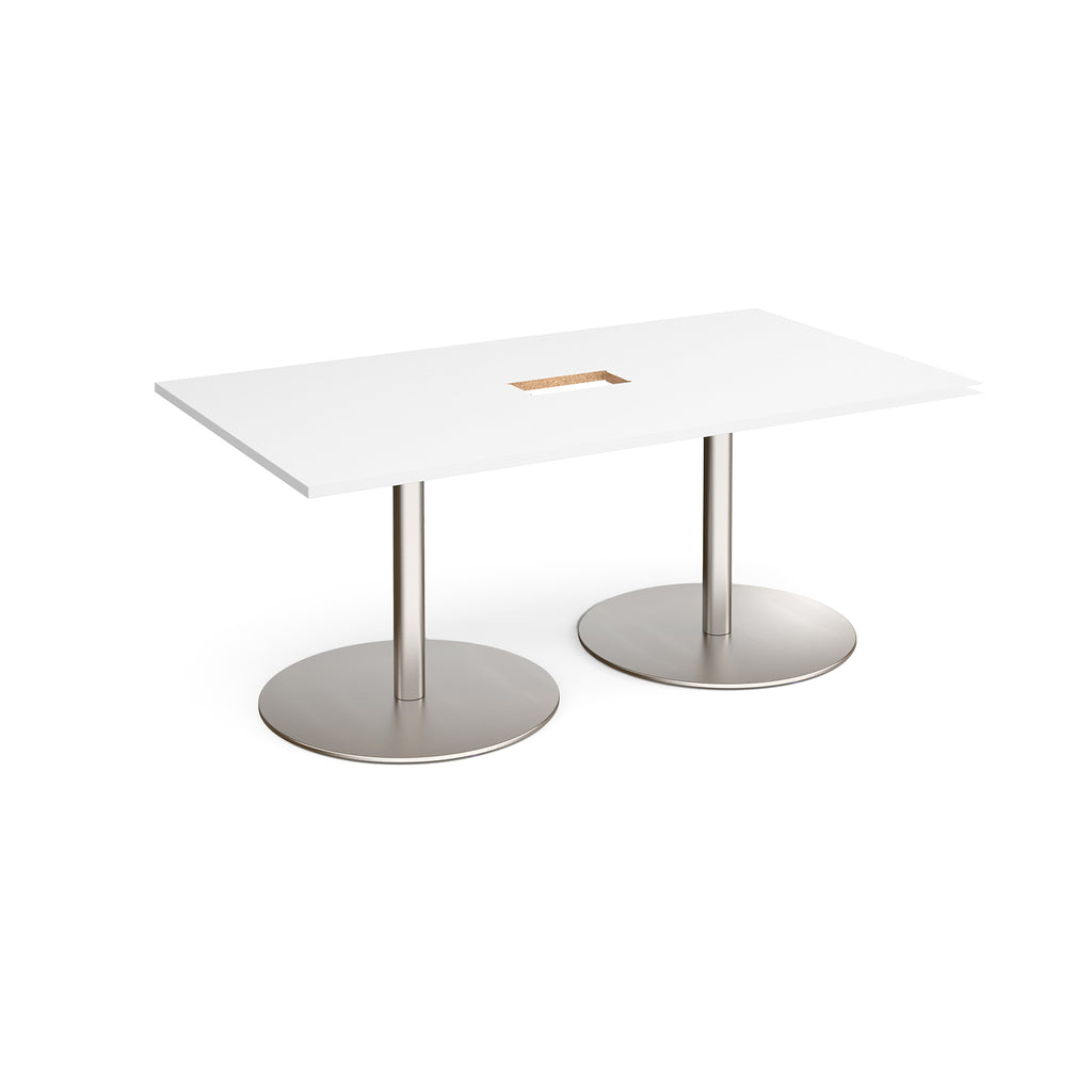 Rectangular table with with top with central cut-out and two metallic pedestal bases on a white background