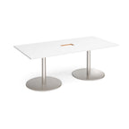 Rectangular table with with top with central cut-out and two metallic pedestal bases on a white background
