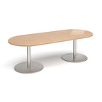 A modern oval conference table with a light oak wood-grain top and dual silver metal pedestal bases, shown on a clean white background.