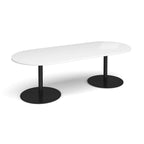 A modern oval conference table with white top and dual black metal pedestal bases, shown on a clean white background.