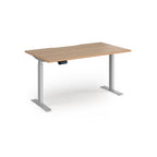 Height adjustable desk with wood-effect top and silver metal frame on a white background