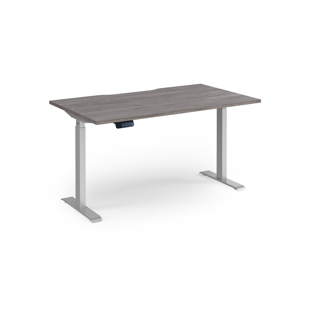 Height adjustable desk with grey wood-effect top and silver metal frame on a white background