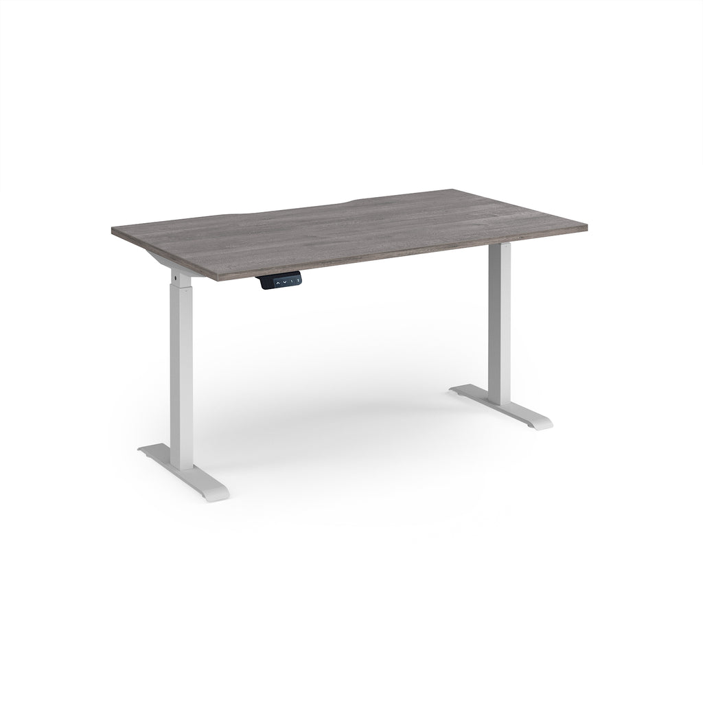Height adjustable desk with grey wood-effect top and white metal frame on a white background