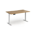 Height adjustable desk with wood-effect top and white metal frame on a white background