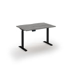 Rectangular desk with grey top and black legs on a white background