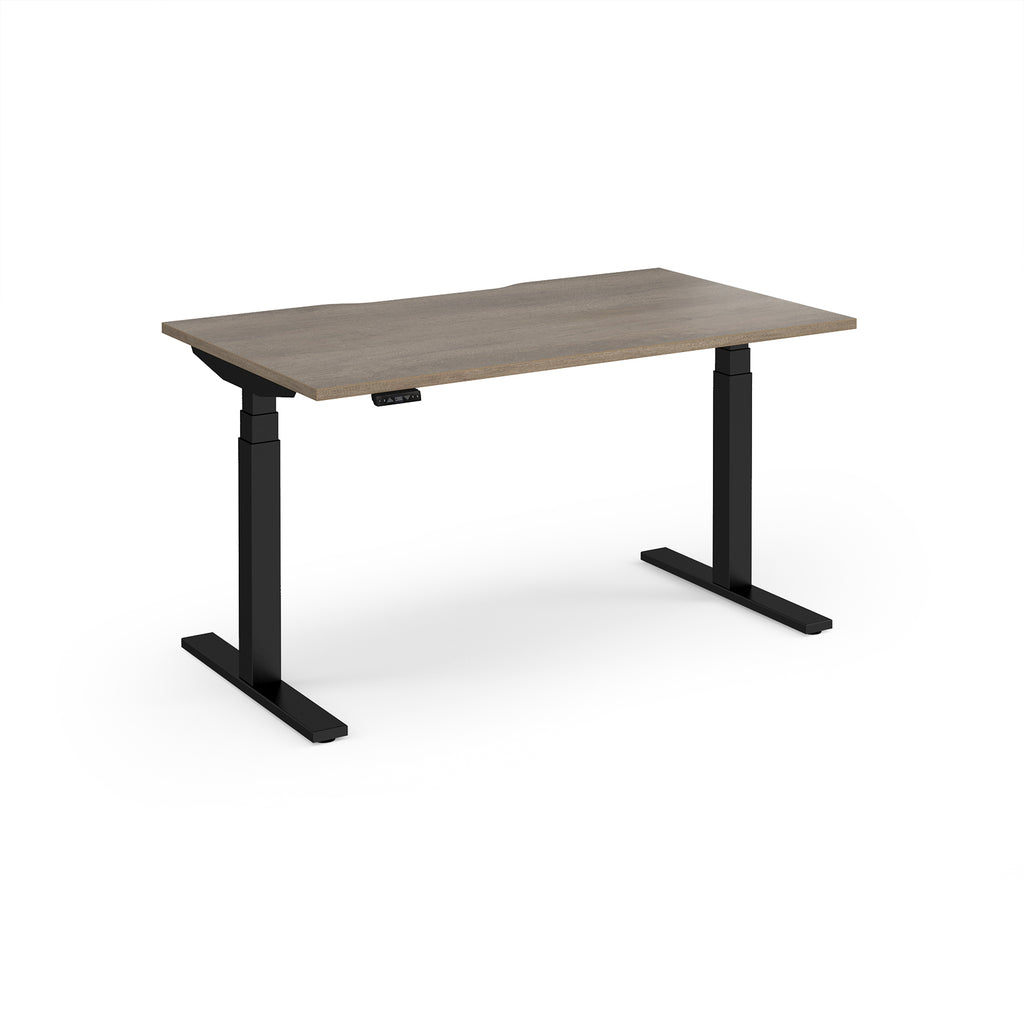 Sit-stand desk with wood-effect top and black legs on a white background