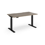 Sit-stand desk with wood-effect top and black legs on a white background