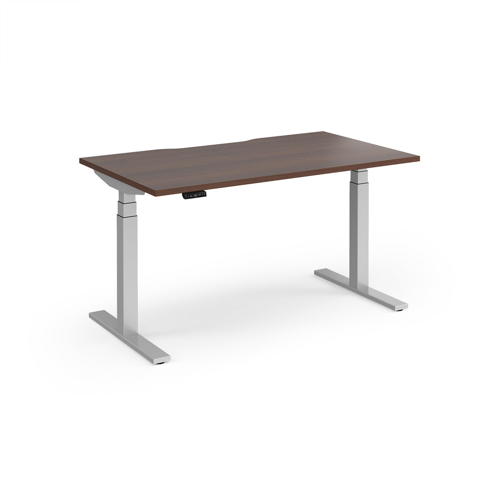 Sit-stand desk with wood-effect top and silver legs on a white background