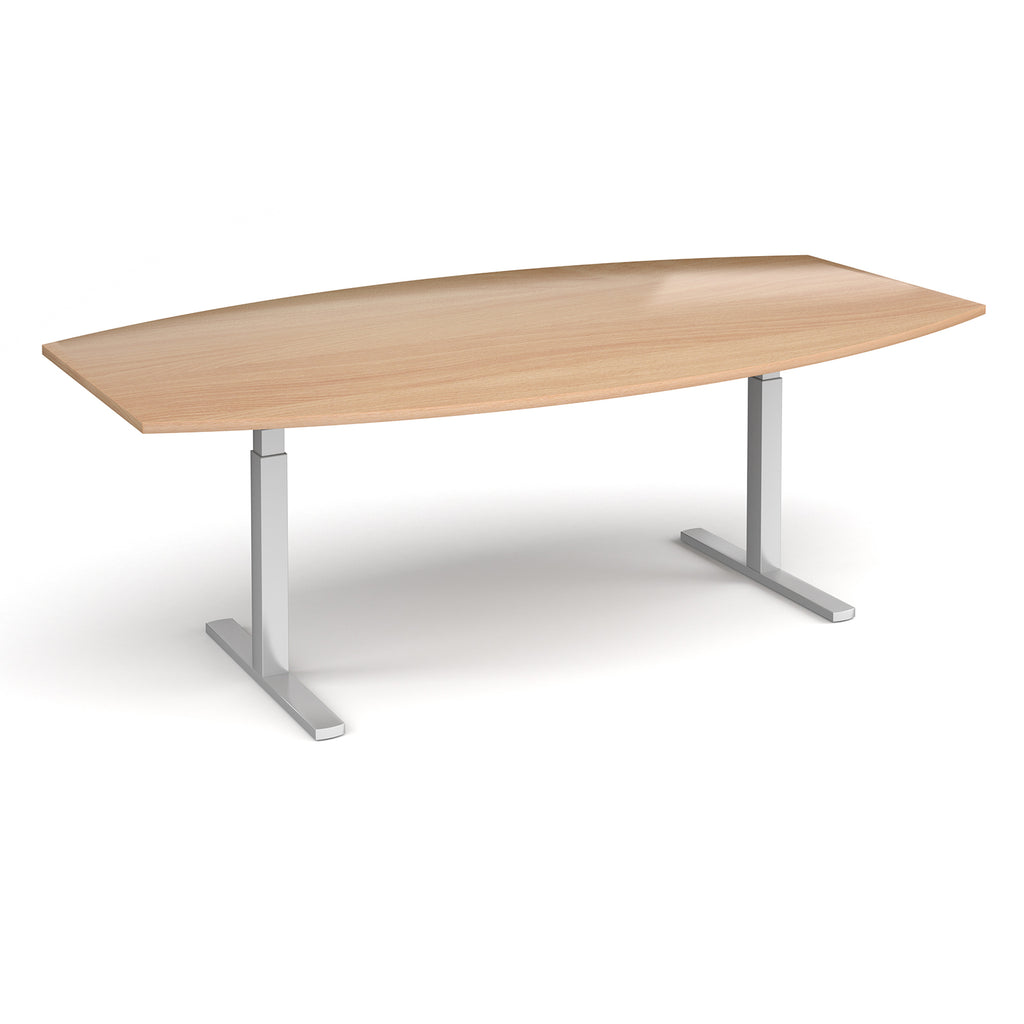An adjustable height conference table with a light oak wood grain top and silver metal pedestal legs, shown on a clean white background.
