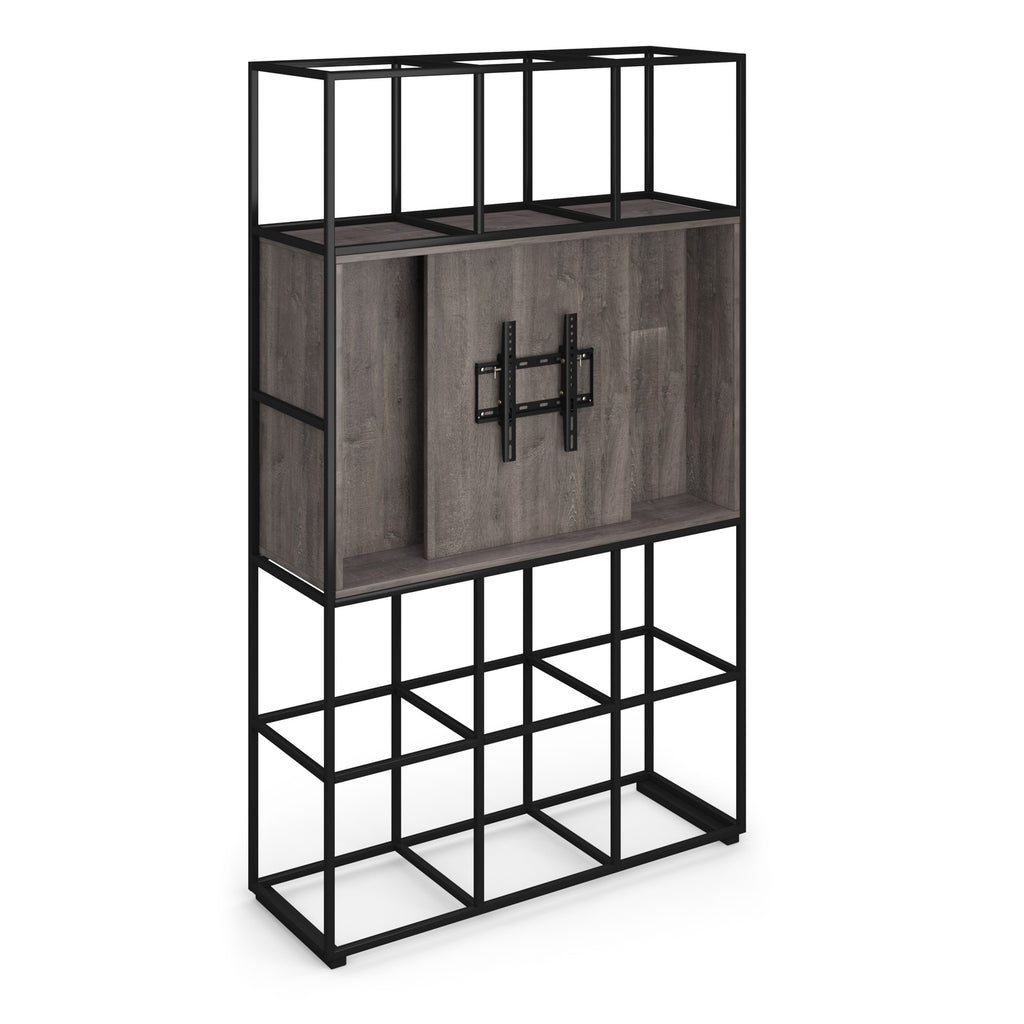 A modern shelving unit with a black metal frame and grey wood grain shelves, featuring a central cabinet module with a black mounting plate.