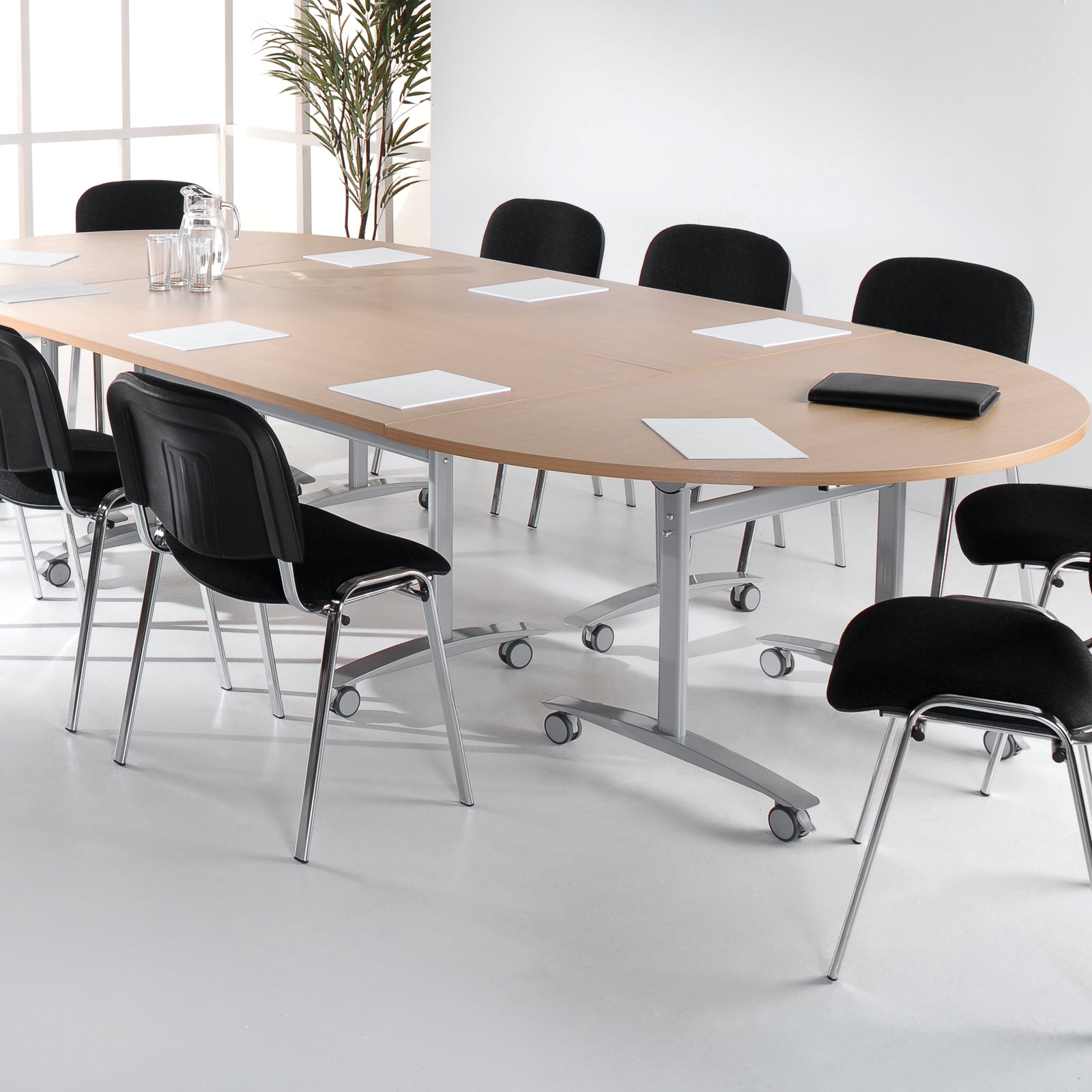 Conference table with chairs in a modern office setting