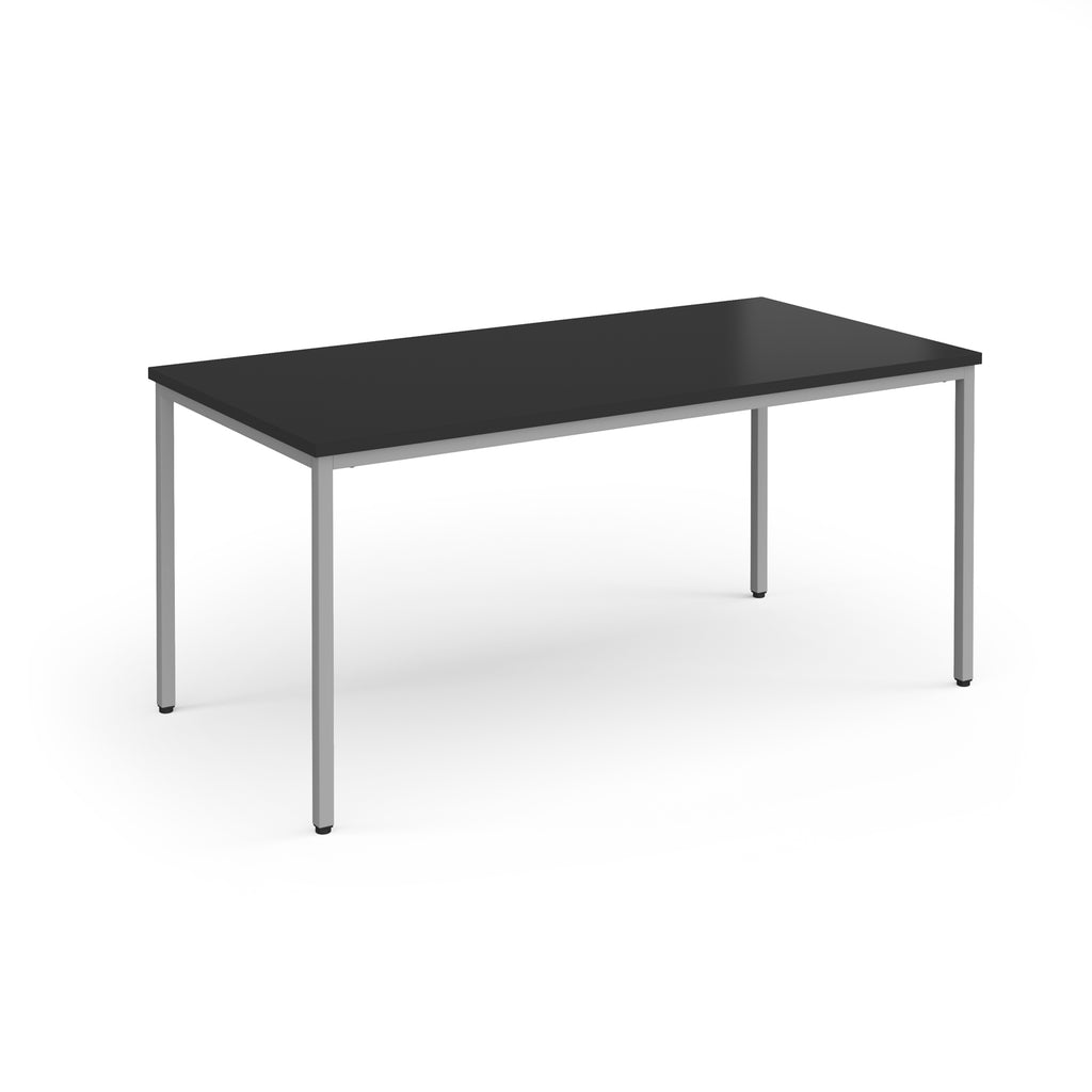 Black rectangular table with silver legs on a white background