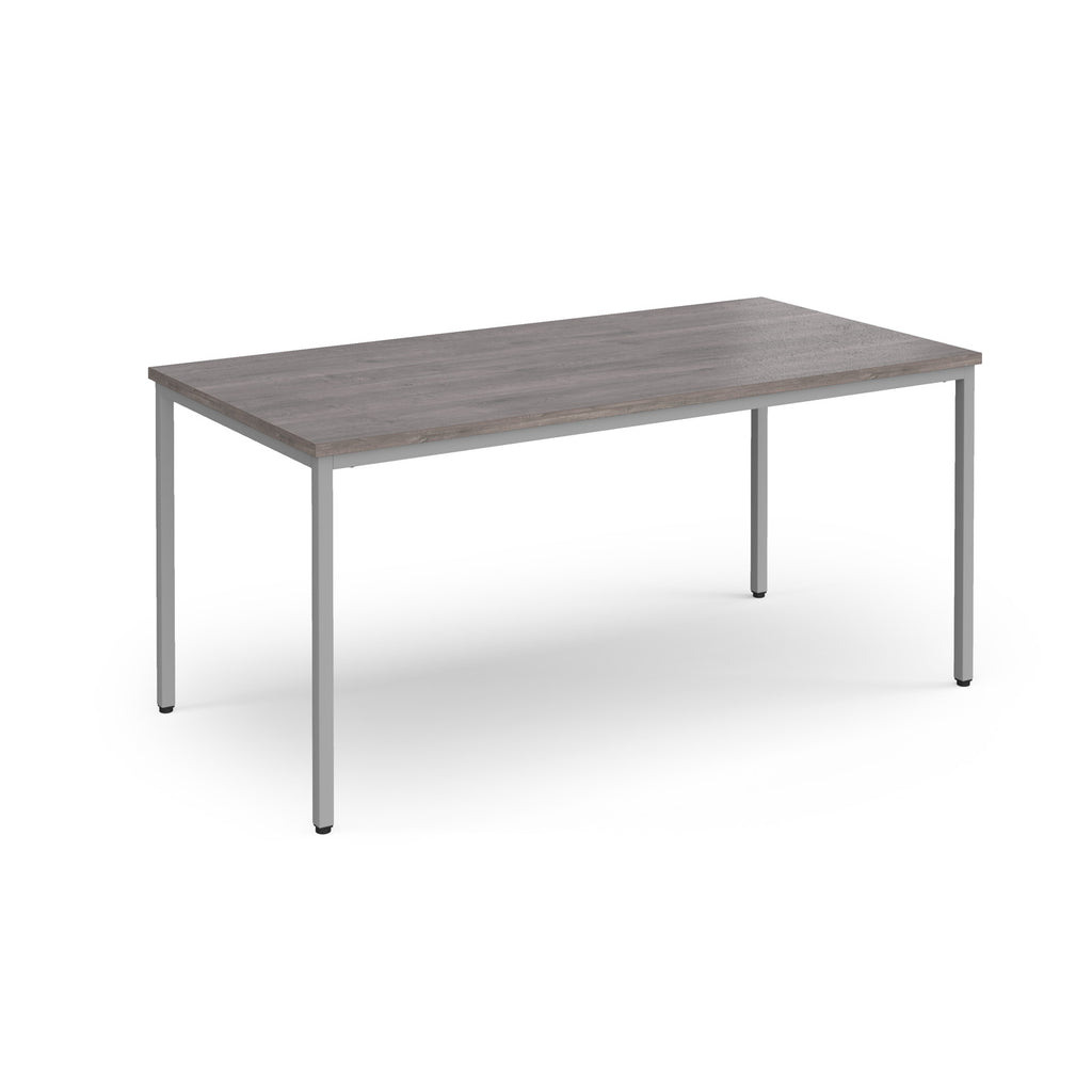 Rectangular table with a wooden top and metal legs on a white background