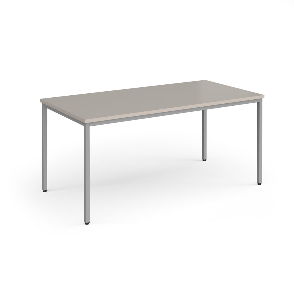 Rectangular table with a light grey top and silver legs on a white background
