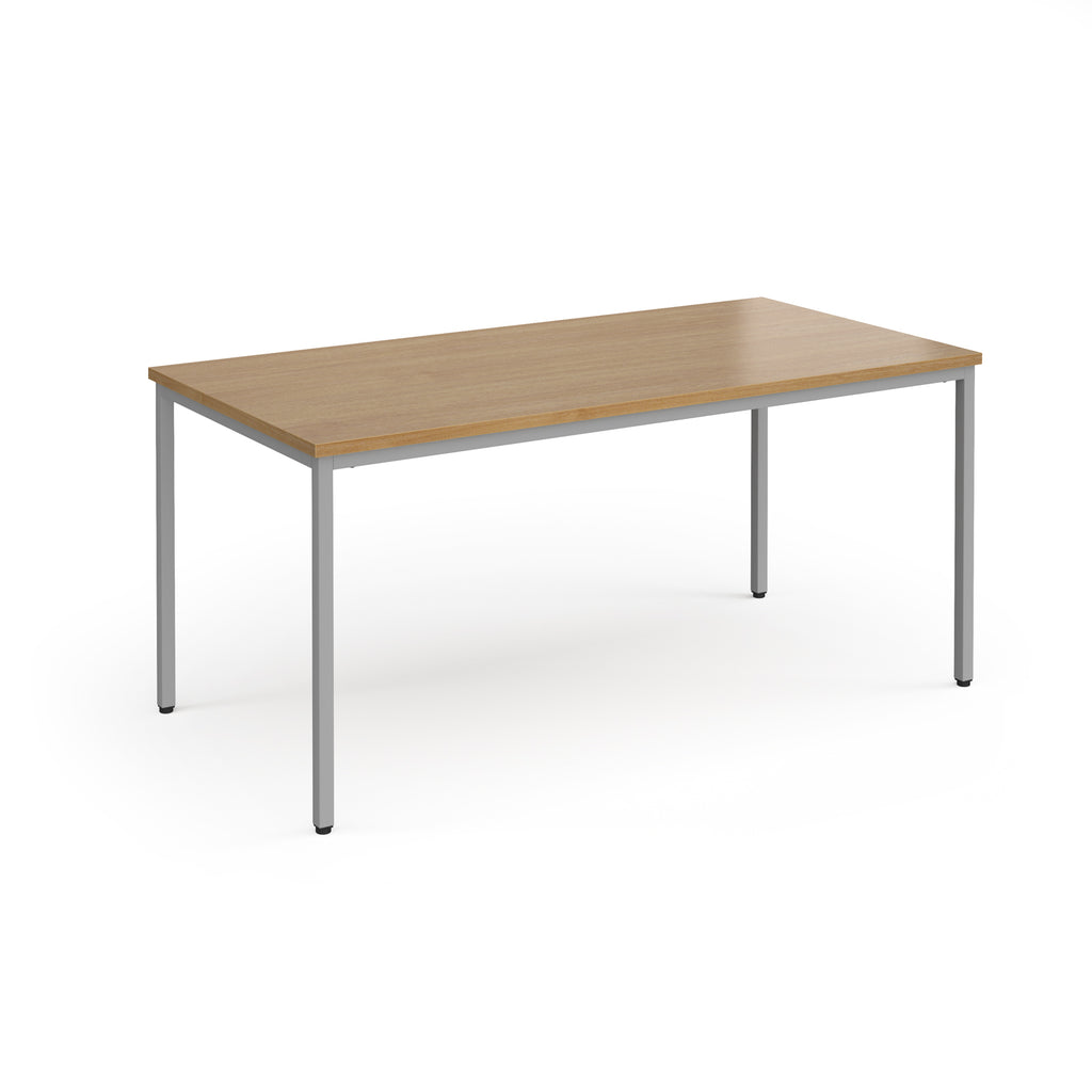 Rectangular table with wooden top and metal legs on a white background