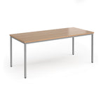 Rectangular table with wooden top and metal legs on a white background