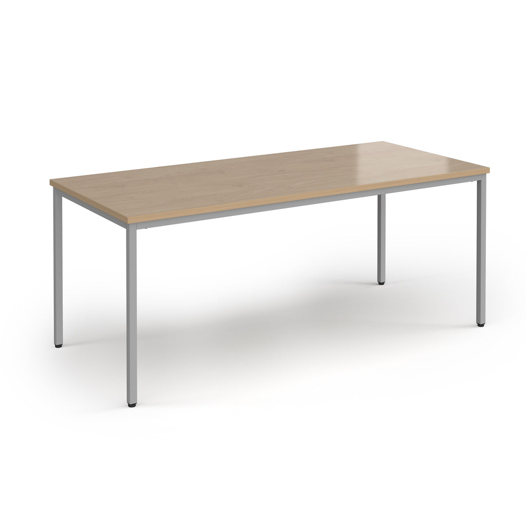 Rectangular table with wooden top and metal legs on a white background