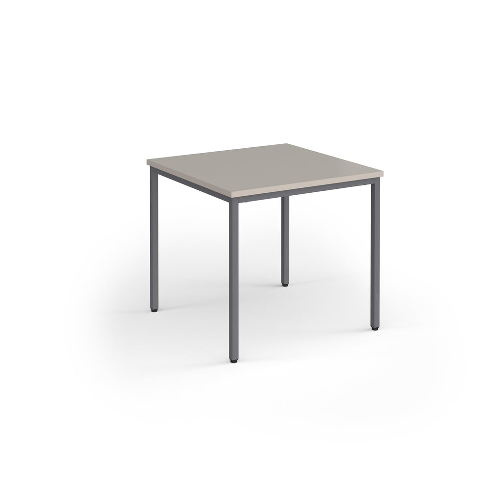 Square table with grey top and legs on a white background
