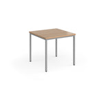 Square table with wooden top and metal legs on a white background