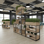 A modern black metal and light wood shelving unit with built-in planters, styled in a contemporary office space with light wood floors and industrial ceiling details.
