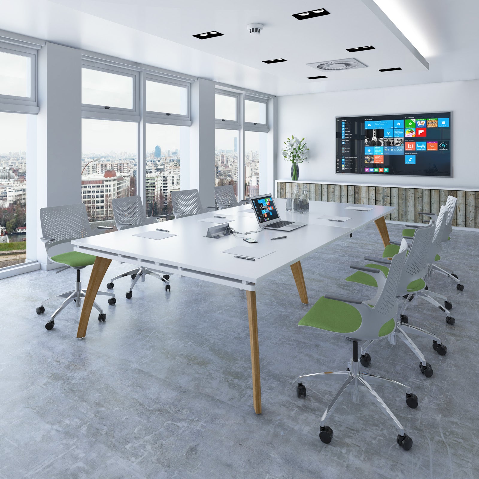 Modern office conference room with a large white table, chairs, and a wall-mounted screen displaying a colorful interface.